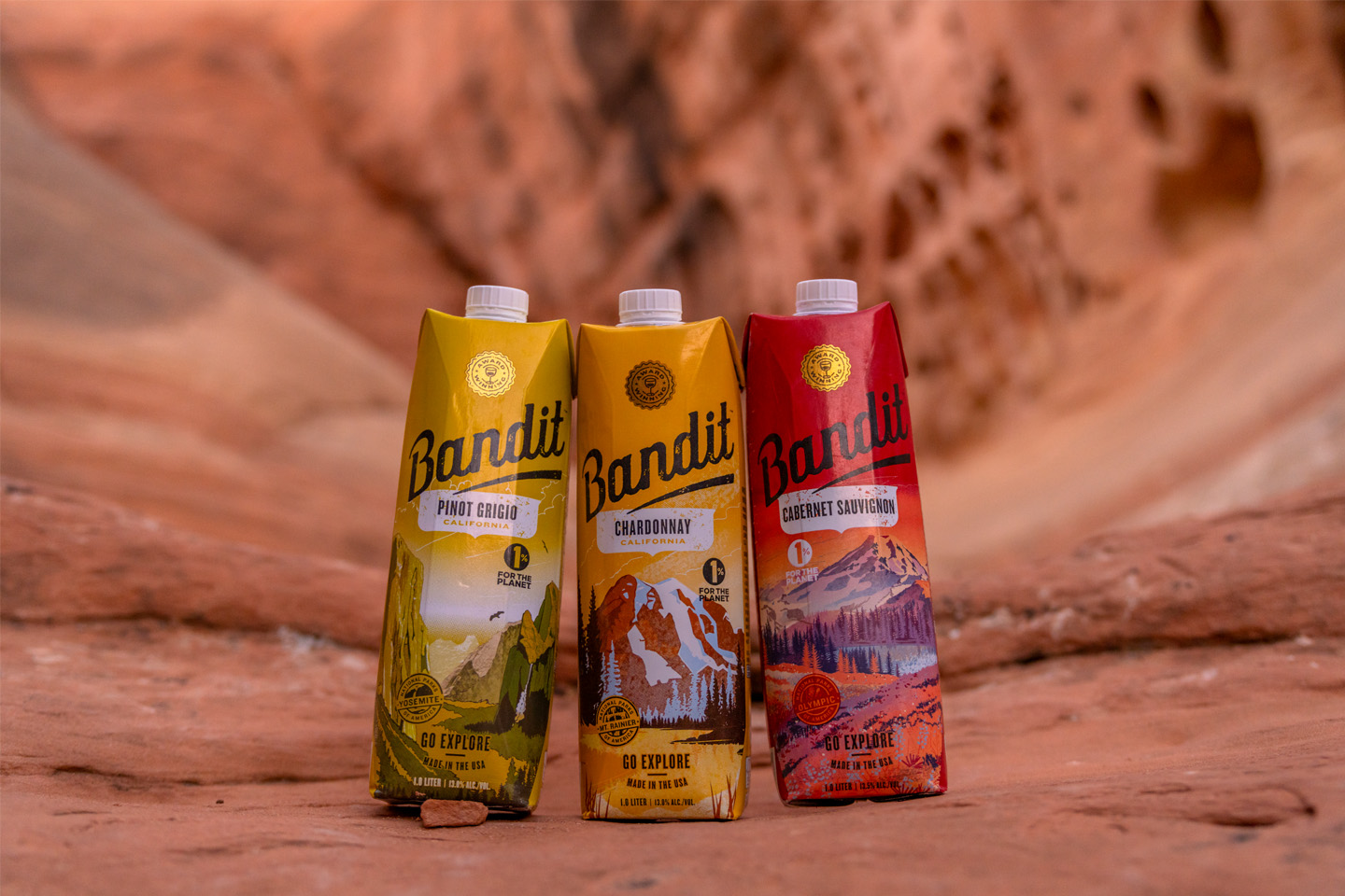 Bandit home page hero image showing three Bandit products on a red rock surface with a blurry red rock background
